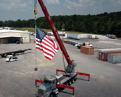 Crane Hoisting American Flag